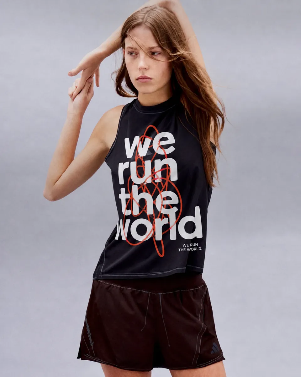 Runner wearing the black We Run the World tank